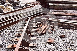 Railroad graveyard of tracks rocks and cross ties