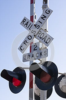 Railroad level crossing sign and lights in emergency mode