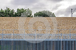 Railroad metal fence over gravel background in england uk