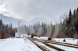 Railroad through the Mountains on a foggy Winter Day