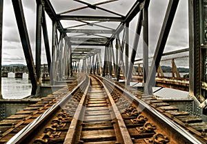 Railroad old rusty bridge crossing a lake in tauranga new zealand