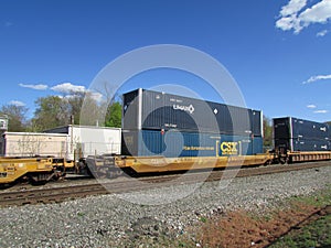 Railroad platform cars with Umax and CSX intermodal containers in West Haverstraw, NY.