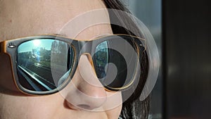 Railroad Rails Reflecting in Sunglasses of Female