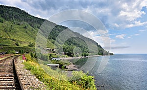 Railroad and sparsely populated village on shore of Lake Baikal