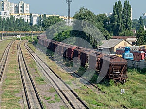 Railroad station. Freight train wagons on rails close-up