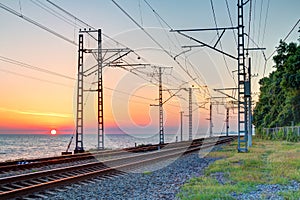 Railroad and sunset over sea