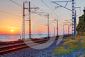 Railroad and sunset over sea