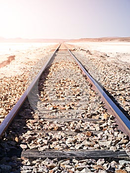 Railroad track in dry salt plains of Altiplano, Bolivia, South America