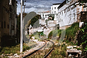 Railroad track extending between live houses