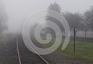 Railroad track in fog