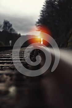 Railroad track with signal lamp in the distance