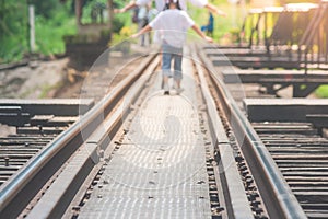 Railroad tracks on The Bridge of River Kwae is historic buildings and landmark of Kancjanaburi Province, Thailand.