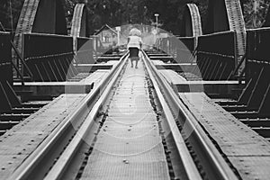 Railroad tracks on The Bridge of River Kwae is historic buildings and landmark of Kancjanaburi Province, Thailand.
