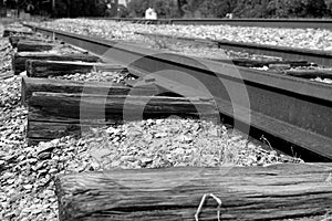 Railroad tracks going through broken stone