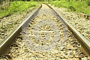 Railroad tracks heading straight ahead. Railway tracks and gravel.