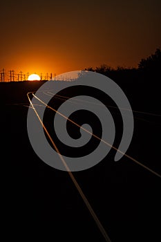 Railroad Tracks Lit During a Golden Summer Sunset