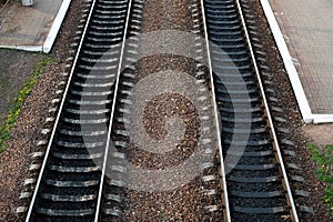 Railroad tracks with railroad switch two paths come together