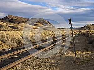 Railroad tracks running through the desert