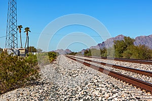 Railroad tracks in Southern Arizona await the next freight train