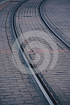 Railroad tracks in the station in the street.