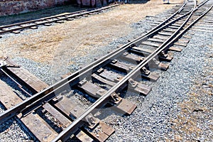 Railroad tracks on sunny summer day. Railway arrow switch tracks
