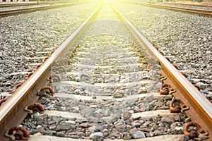 Railroad tracks at sunset. Railroad tracks heading straight ahead