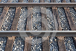 Railroad Tracks and Wooden Ties on a Stone Track Ballast