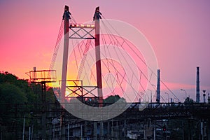 Railroad transportation, freight cars in industrial seaport at sunset