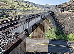A railroad trestle crosses Highway 216 at Winter Water Creek near Tygh Valley, Oregon, USA