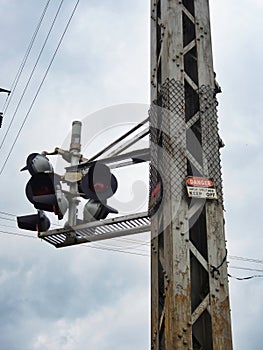 Railroad lights with stormy sky