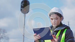 Railroad worker using tablet