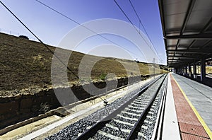 Railroads in Cuenca Train Station under the sunlight and a blue sky in Spain