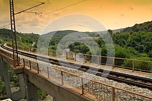 Rails and bridge crossing river