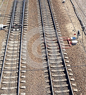 Rails on concrete sleepers, arrows and track equipment