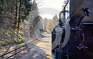 Rails of the Harz narrow gauge railway with steam locomotive. Dynamic through motion blur