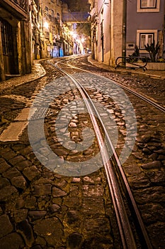 Rails of tram 28 through the Alfama district in Lisbon, Portugal