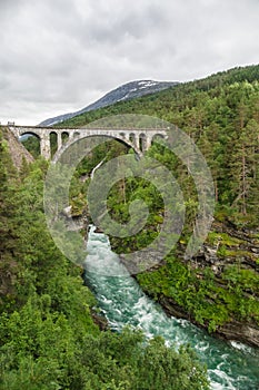 Railway arch bridge Kylling crosses Rauma river