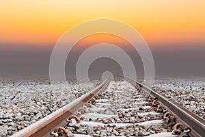 Railway in arid area, sunset time