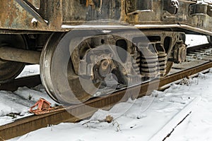 Railway brake shoe under the train wheel on the rails