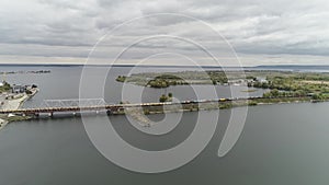 Railway bridge across the river and a freight train