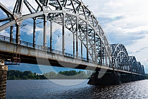 Railway Bridge Dzelzcela tilts over Daugava River photo