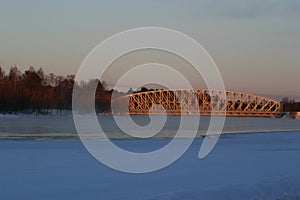 A railway bridge in evening sun on a winter day