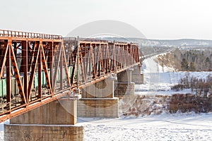 A railway bridge on a frozen river.