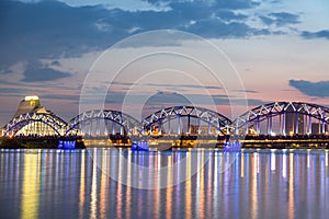 Railway Bridge with national library at sunset twilight in Riga, Latvia