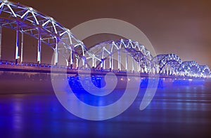 Railway bridge at night in Riga
