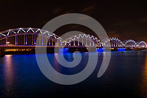 Railway bridge at night in Riga, Latvia