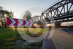 Railway bridge over the Irpin River in the autumn foggy morning. photo