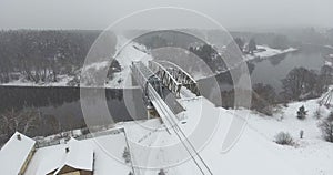 Railway Bridge over the River Neris in Santaka. Lithuania. Snowy Winter Day. Drone