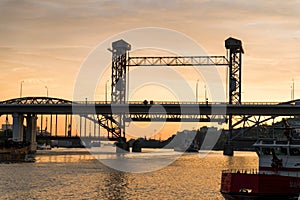 Railway bridge over river at sunset. Beautiful landscape