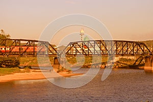 Railway bridge over a river with vintage sunset color tone and copy space add text photo